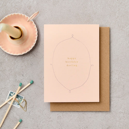 Happy Birthday Darling card with decorative oval frame and gold foil lettering on blush pink - luxury birthday card - Katie Leamon