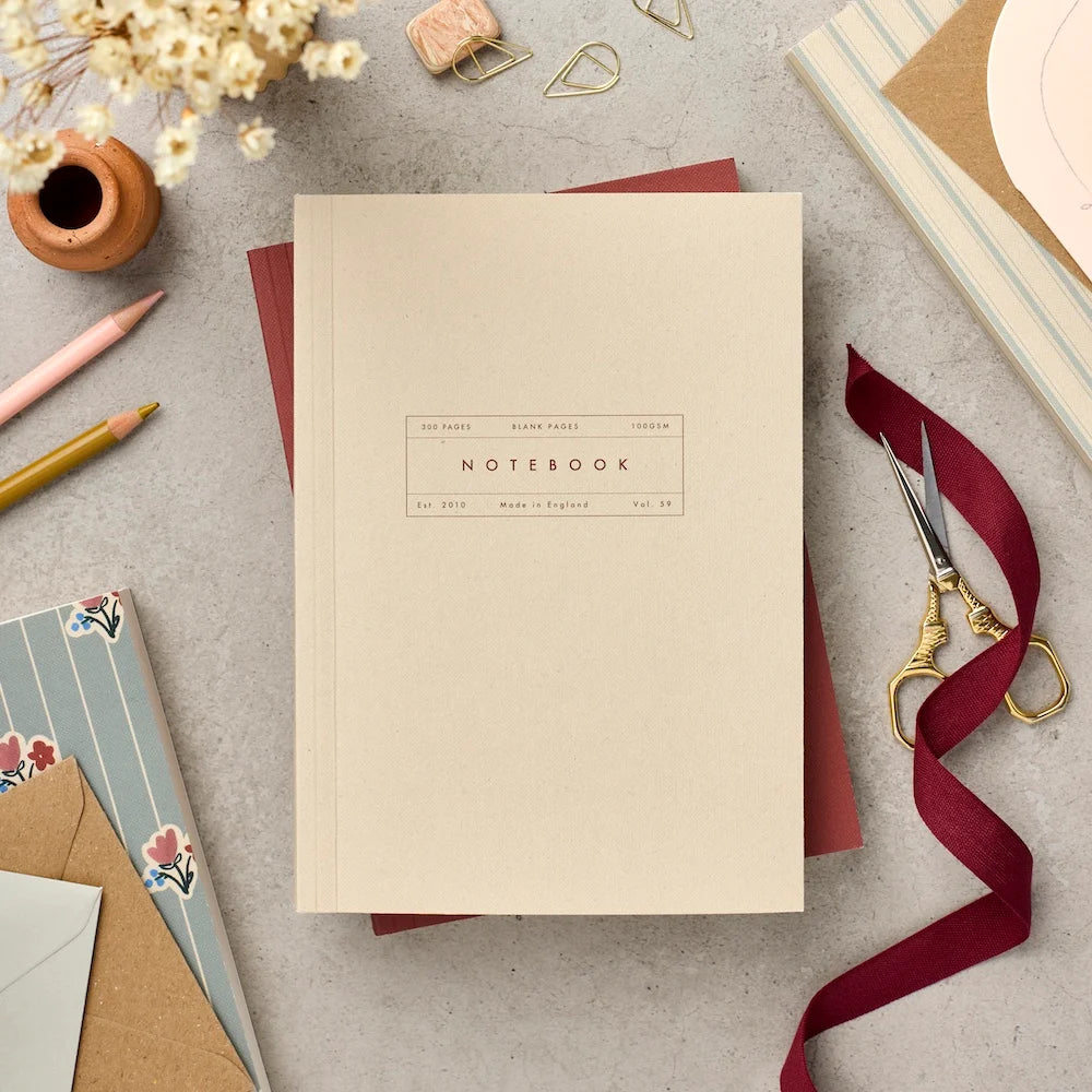Katie Leamon Vol.59 A5 lay-flat notebook in plain ecru with minimal label detail, 300 blank ivory pages