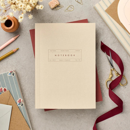 Katie Leamon Vol.59 A5 lay-flat notebook in plain ecru with minimal label detail, 300 blank ivory pages