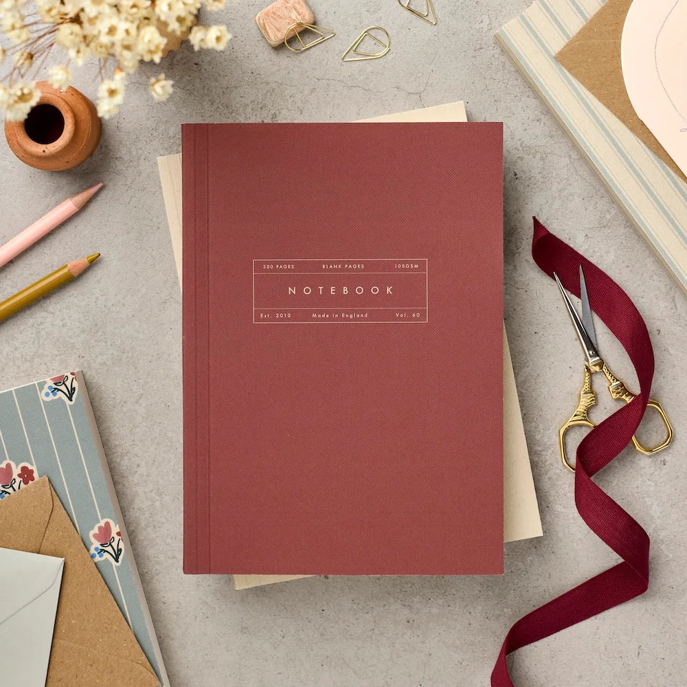 Katie Leamon Vol.60 A5 lay-flat notebook in rich claret with gold label detail, 300 blank ivory pages